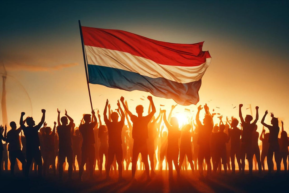 En gruppe mennesker som vifter med Nederlands flagg