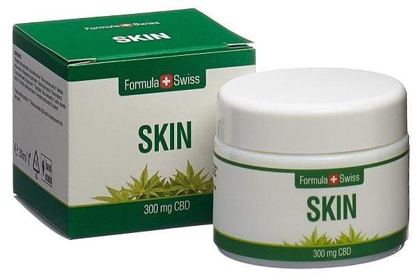 Formula Swiss CBD Skin med 300 mg CBD på en stein ved en foss